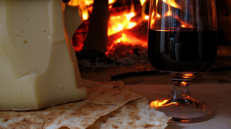 cheese and wine on a table