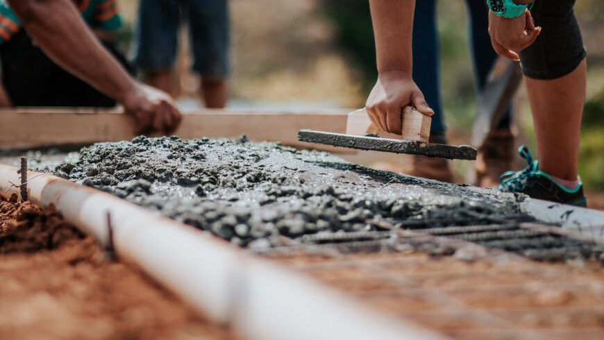 People volunteering and building a house.