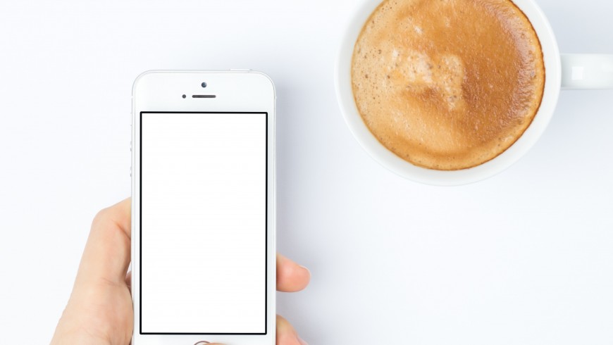 a smartphone and a coffee